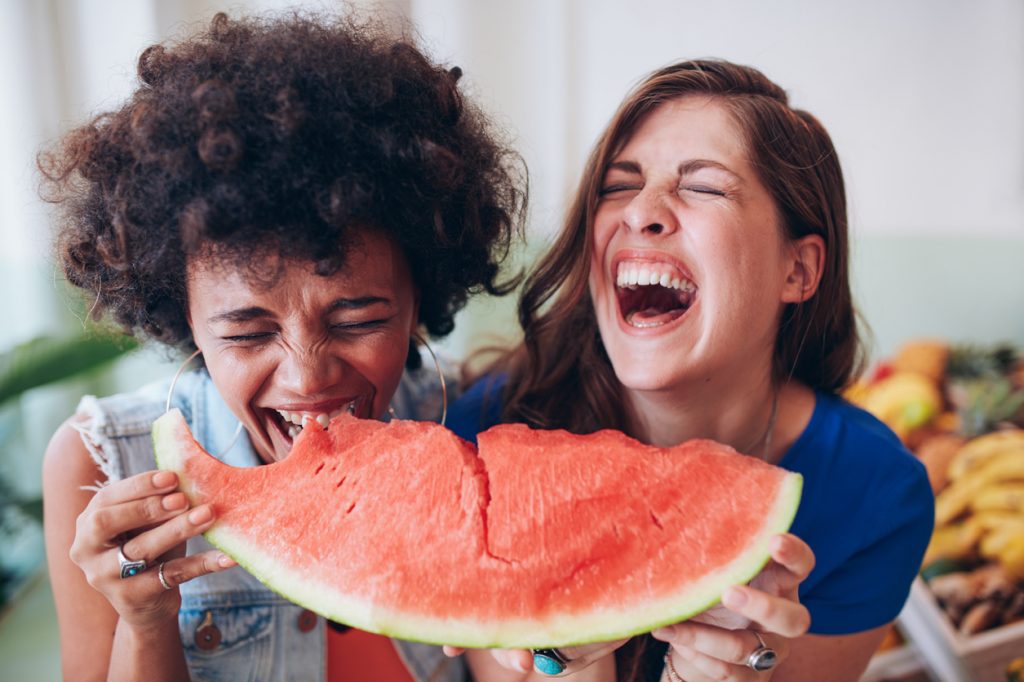 Two young girls enjoying a watermelon at Rush Springs Watermelon Festival